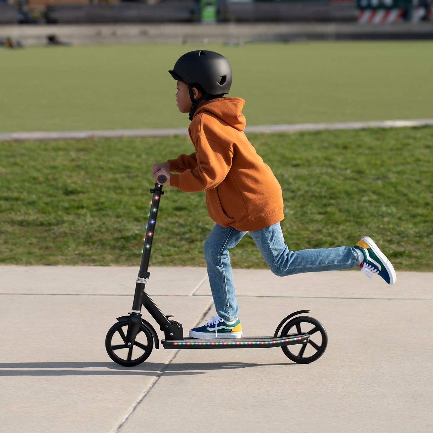 Dluxe Ave. Jetson Scooters - Jupiter Jumbo Kick Scooter (Black) - Collapsible Portable Kids Push Scooter - Lightweight Folding Design with Big Wheels and High Visibility RGB Light Up LEDs on Stem and Deck