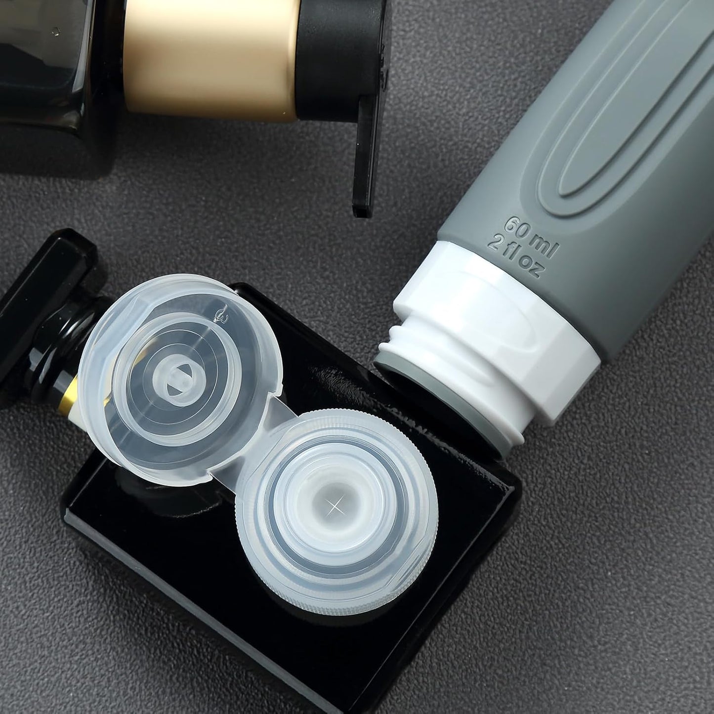 Dluxe Ave. Travel Bottles for Toiletries/ TSA Approved/ 2oz Travel size Bottles/ BPA Free/ 4 Pack